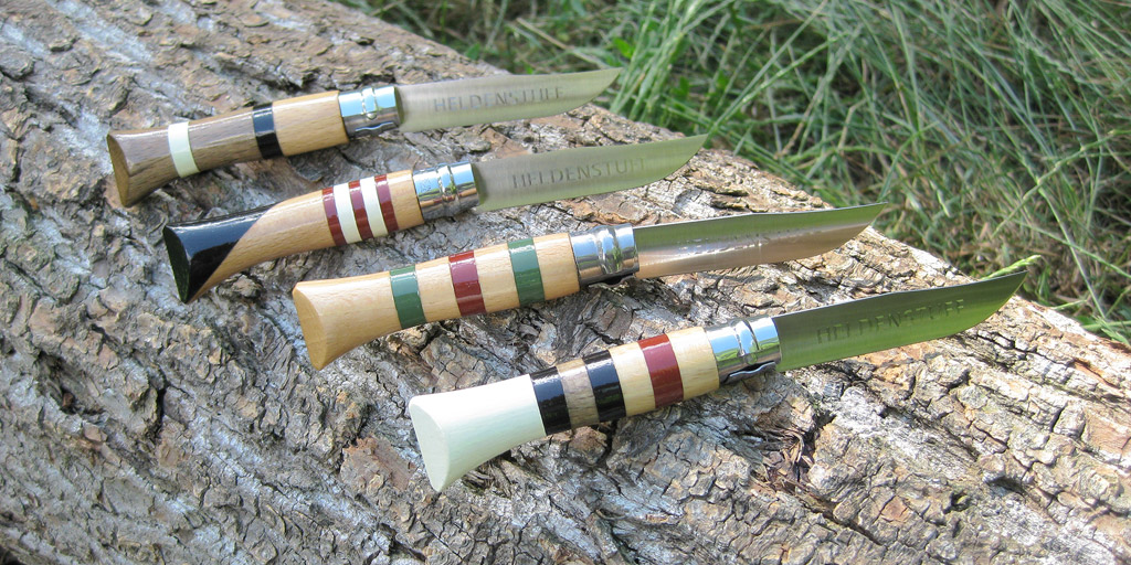 A couple of colorful customized Opinel pocket knives.